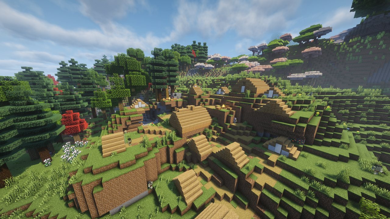 A village of wooden houses on green hills, mushroom trees on the slopes above, under a blue sky.